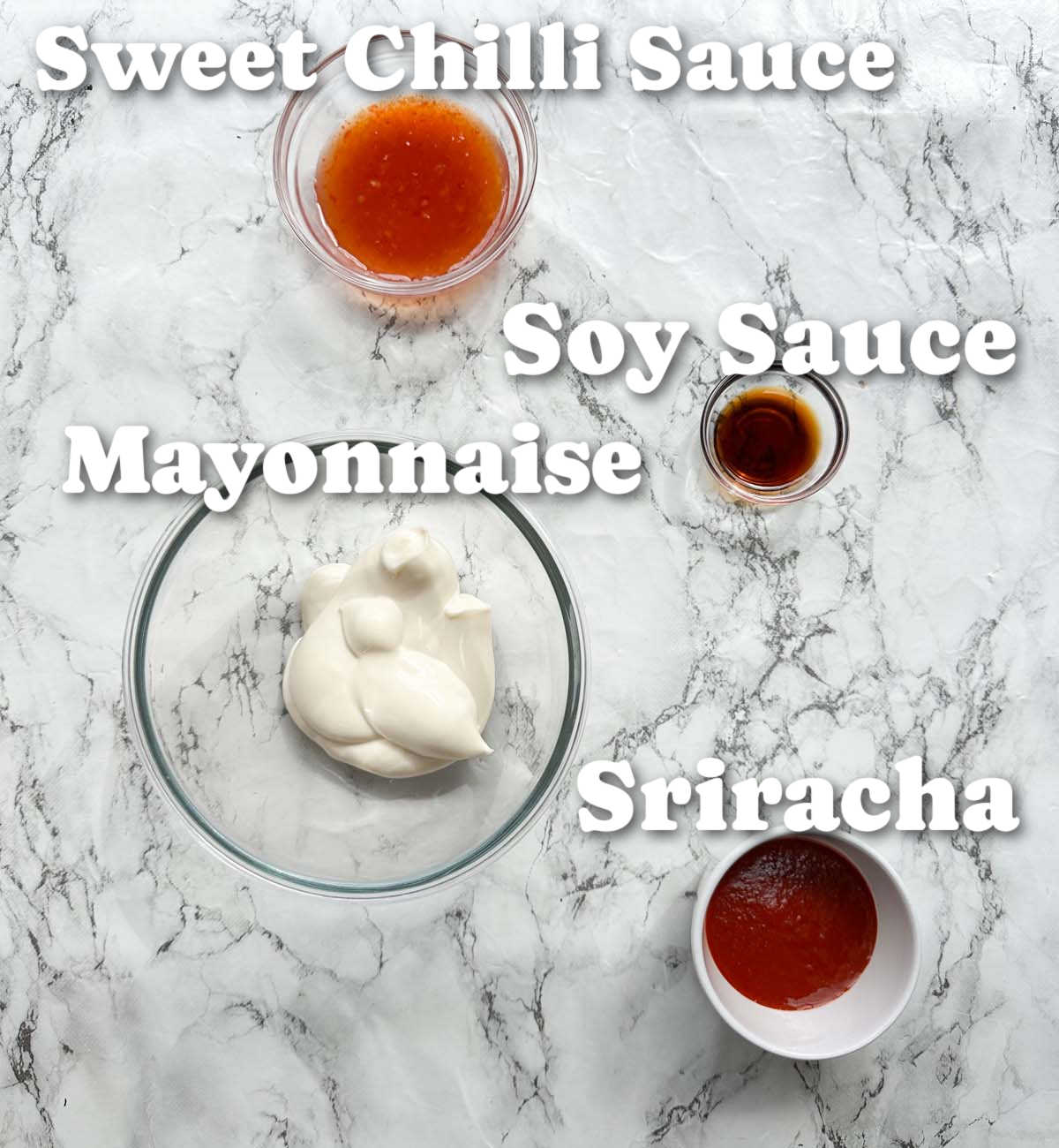 overhead shot of bang bang sauce ingredients with text labels
