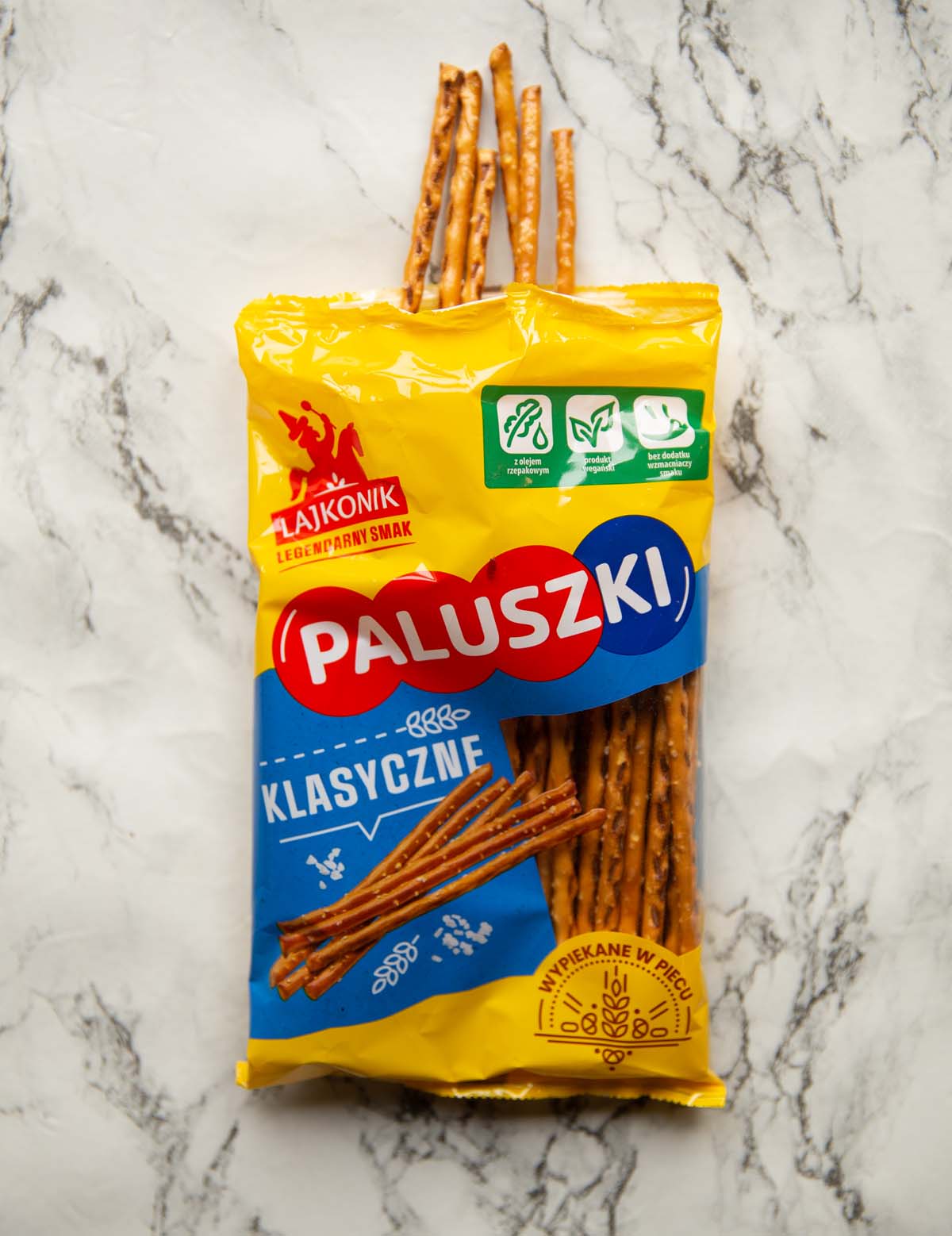 overhead shot of pretzel sticks on marble backdrop