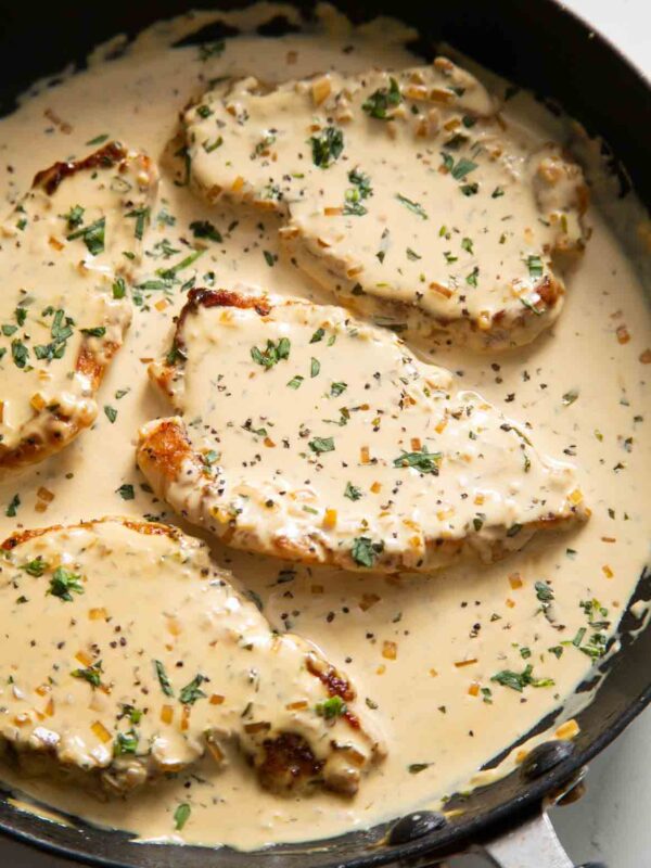 creamy mustard pork chops in large pan