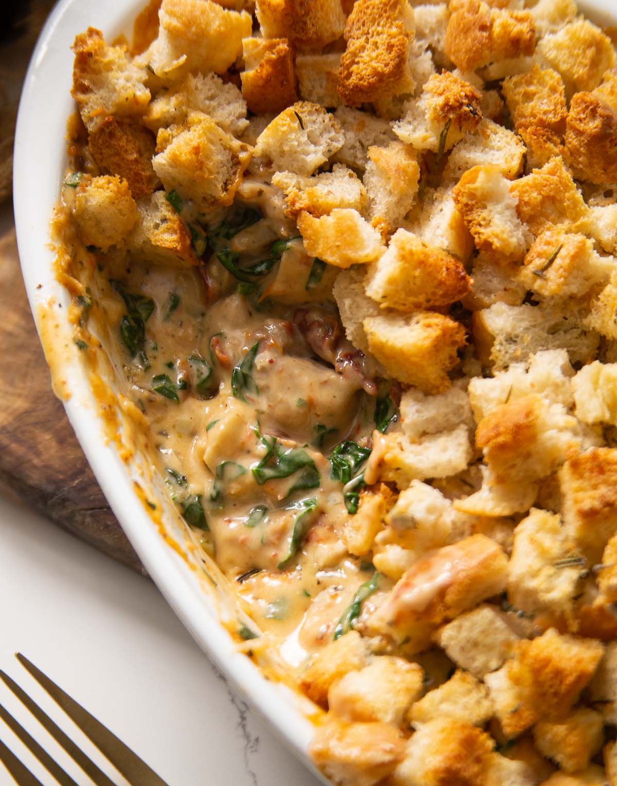 close up shot of Italian chicken bake fresh out the oven with portion removed