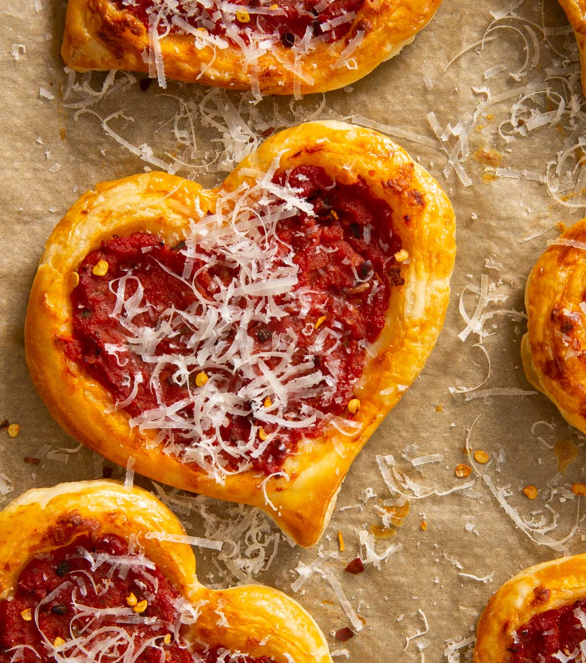 close up overhead shot of pizza love hearts on baking tray