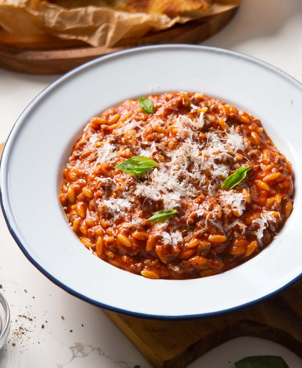 close up shot of beef orzo in large white dish