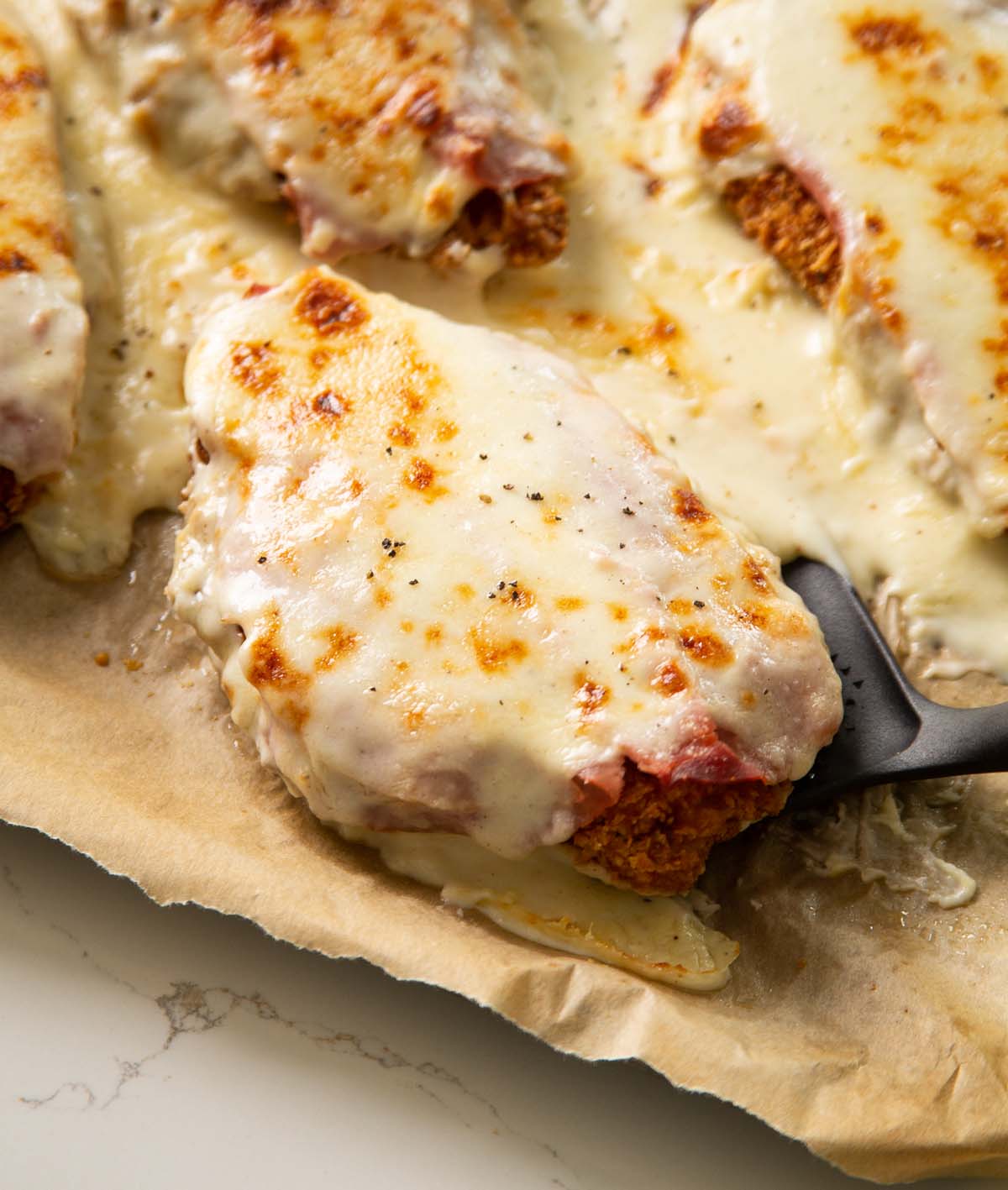 crispy chicken croque monsieur fresh out the oven on baking tray