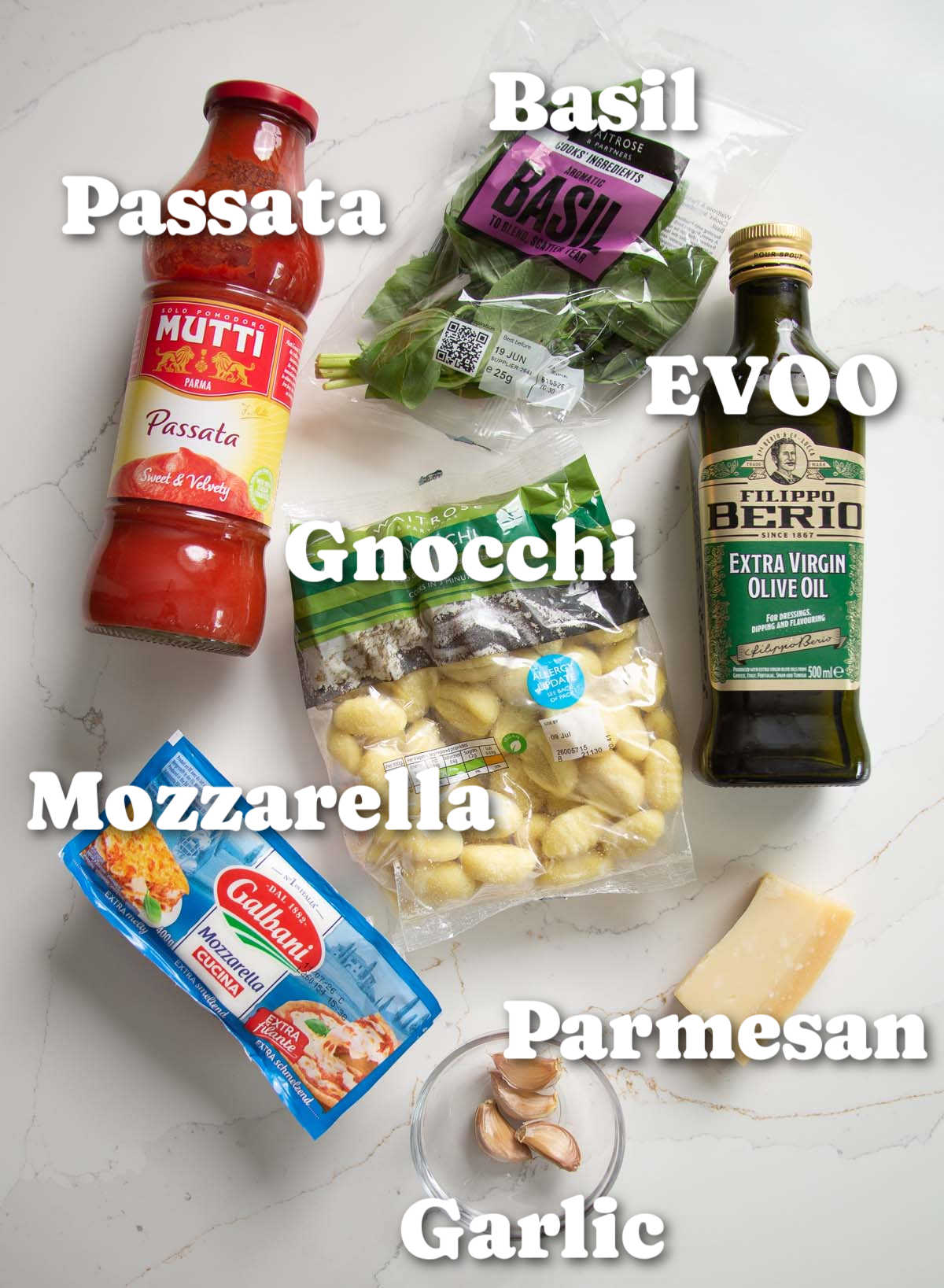 overhead shot of gnocchi alla sorrentina ingredients with text labels