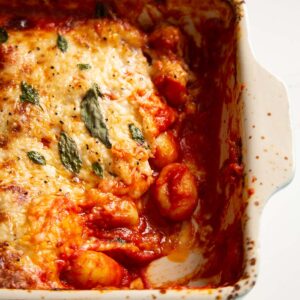 close up shot of gnocchi alla sorrentina with portion taken out of baking dish