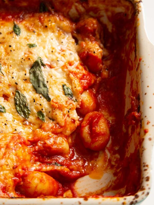 close up shot of gnocchi alla sorrentina with portion taken out of baking dish