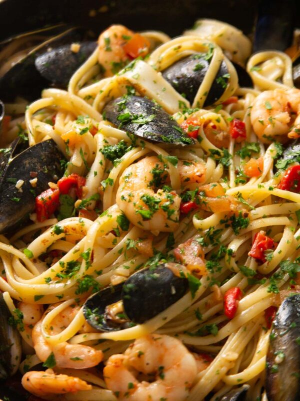 close up shot of seafood pasta in large pan