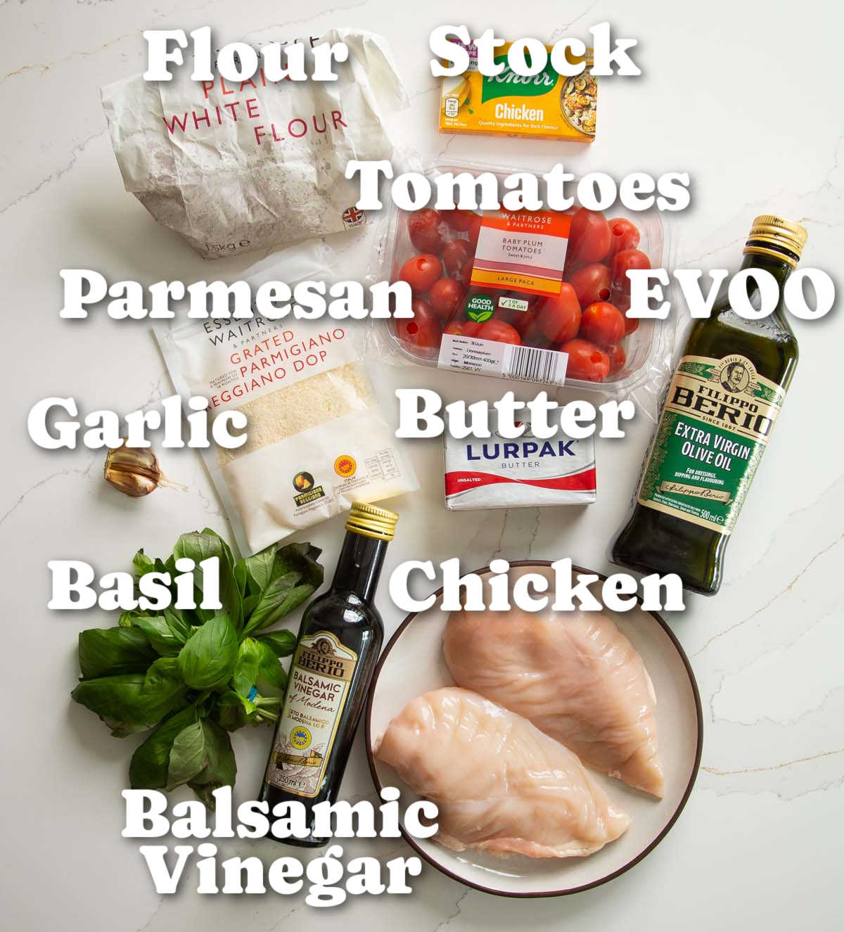 overhead shot of tomato basil chicken ingredients with text labels