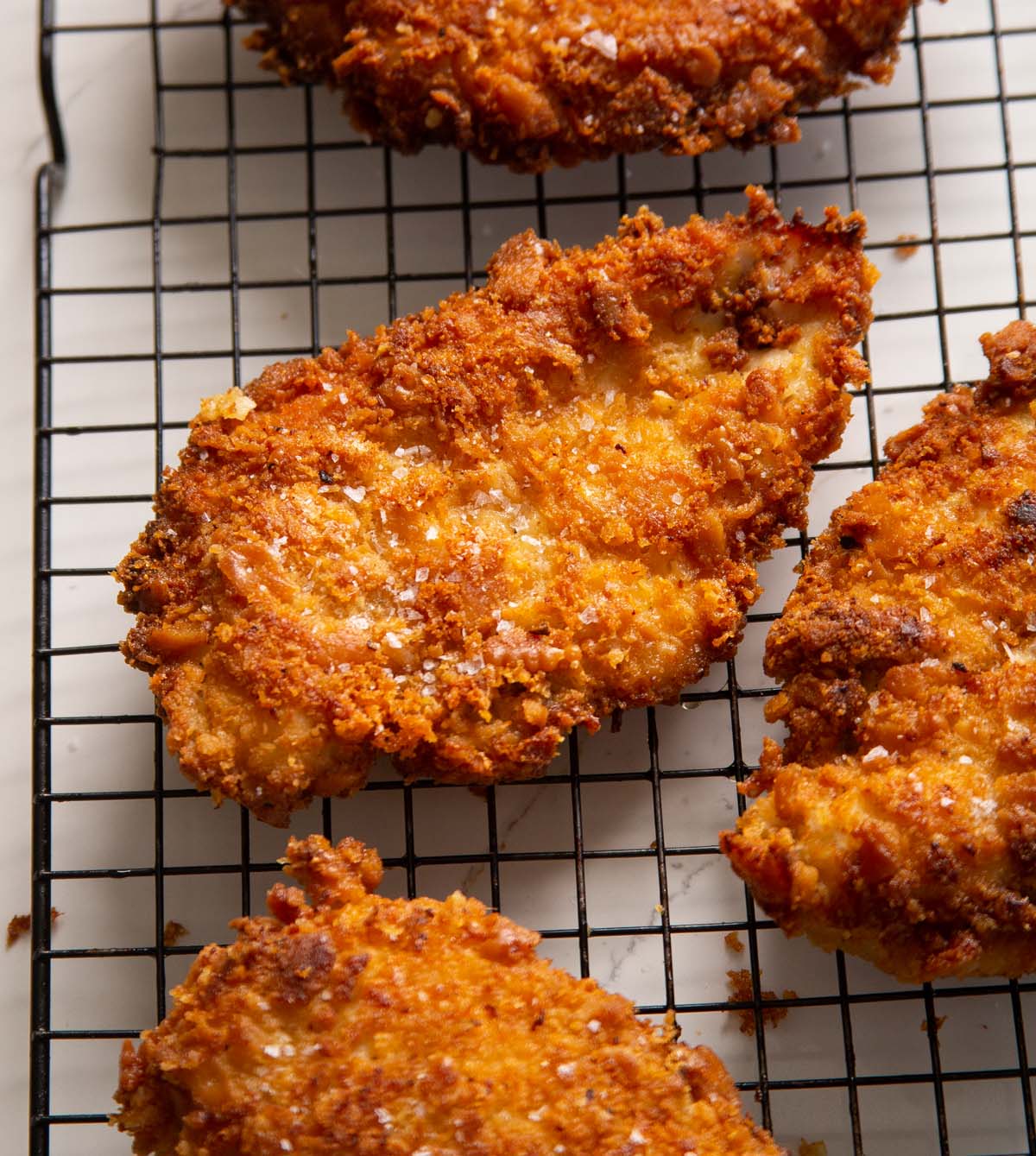 ritz cracker chicken on wire rack with sea salt