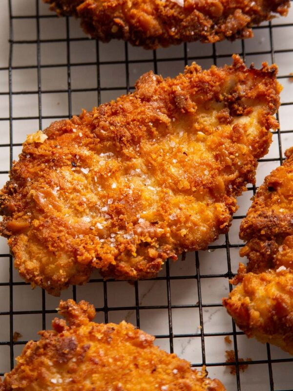 close up shot of ritz cracker chicken on wire rack