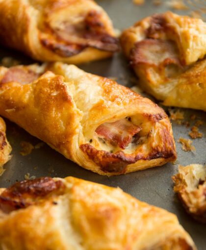closeup over cheese and bacon turnover with focus on bacon